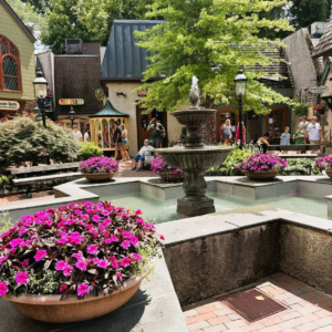 Fountain, flowers, and shops at The Village Shops in Gatlinburg